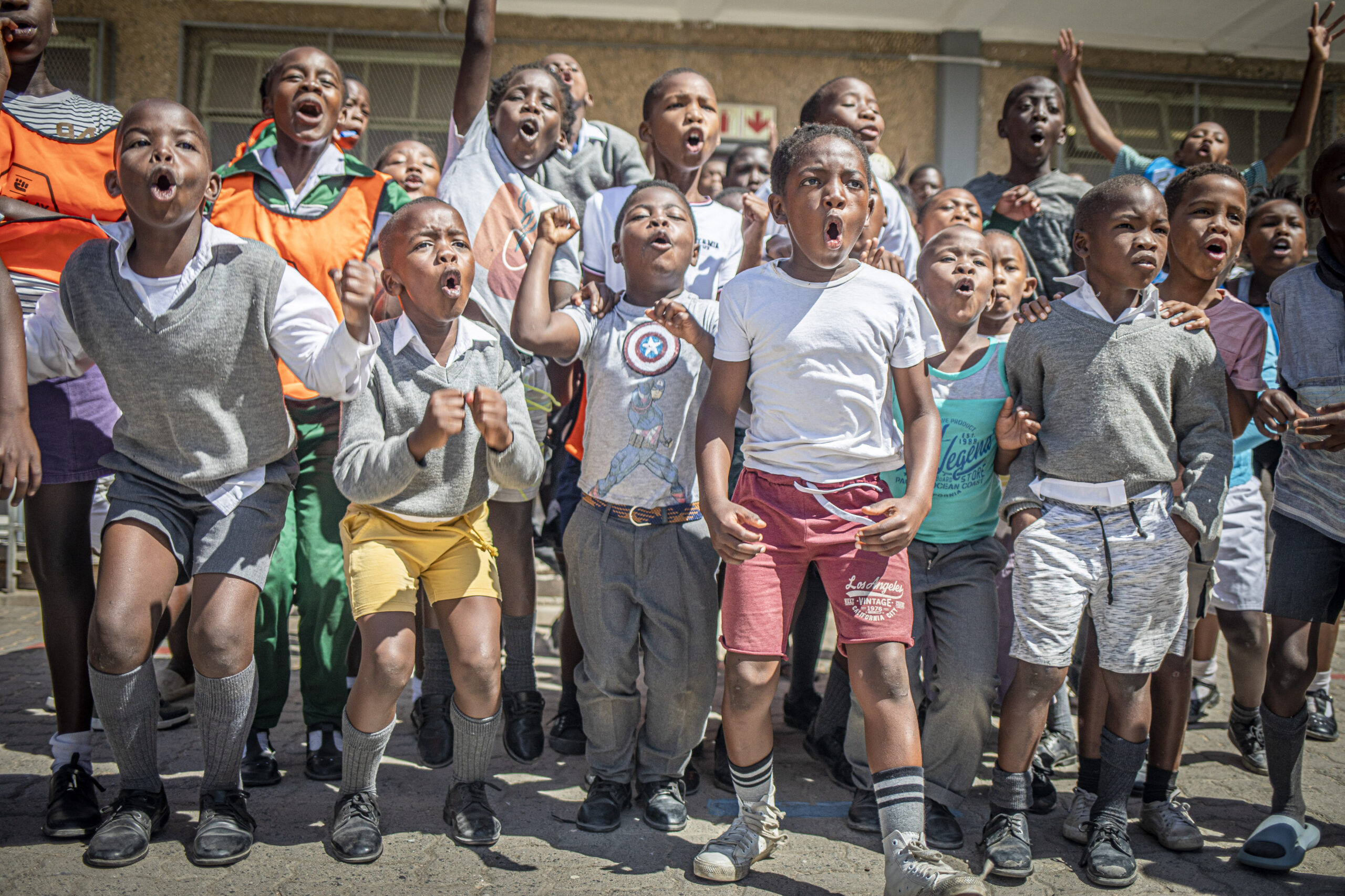 Children playing sports in a South African community